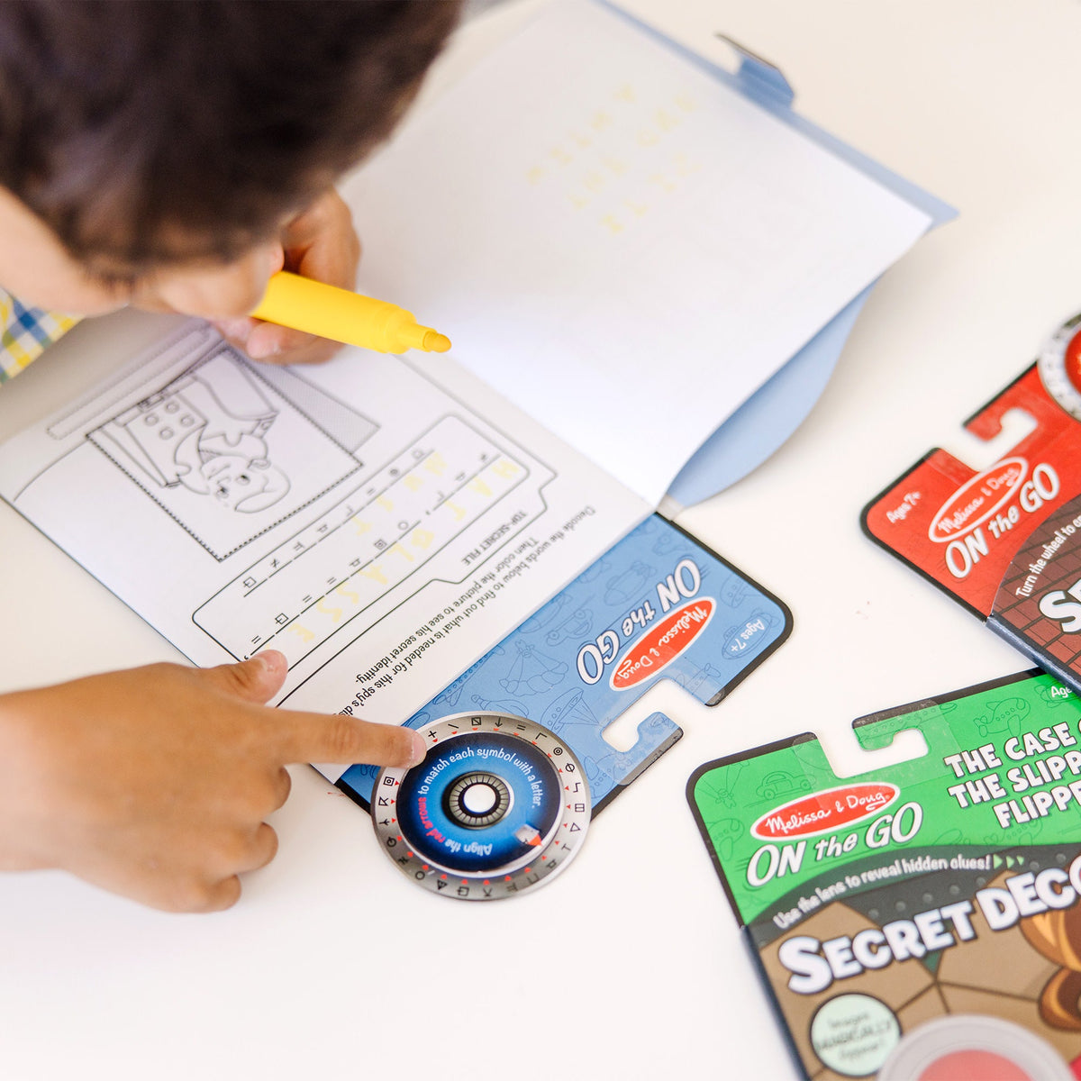 On the Go™ Secret Decoder Activity Books 3-Pack: Slippery Flippers, Runaway Ruby, Game Book product image 3